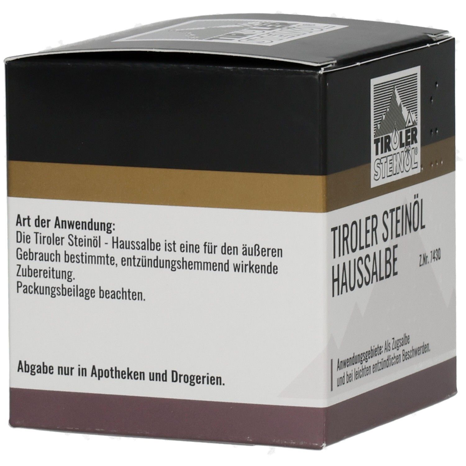 Karton TIROLER STEINÖL HAUSSALBE. Schwarzer Deckel, goldener Streifen, weißer Text. Logo mit Berg. Anwendungshinweise auf der Seite.