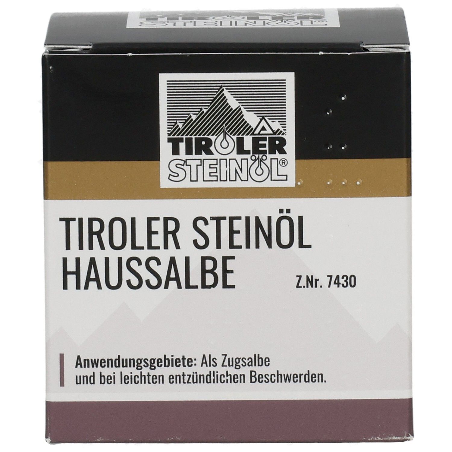 Karton TIROLER STEINÖL HAUSSALBE. Schwarzer Deckel, goldener Streifen, weißer Text. Logo mit Berg. Anwendungsgebiete: Als Zugsalbe.
