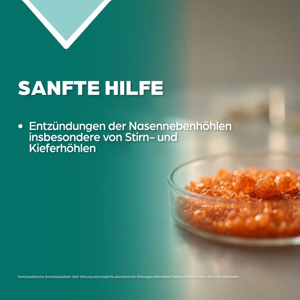 Orangefarbene Kristalle in einer Petrischale, mit Text "Sanfte Hilfe".