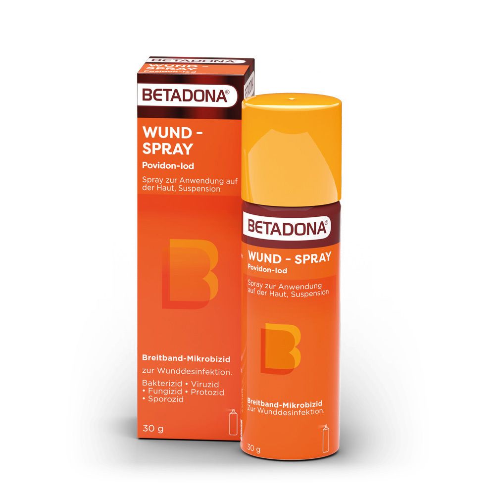 Betadona Wund-Spray und Verpackung. Orange-braune Verpackung und Sprayflasche. Beschriftung.