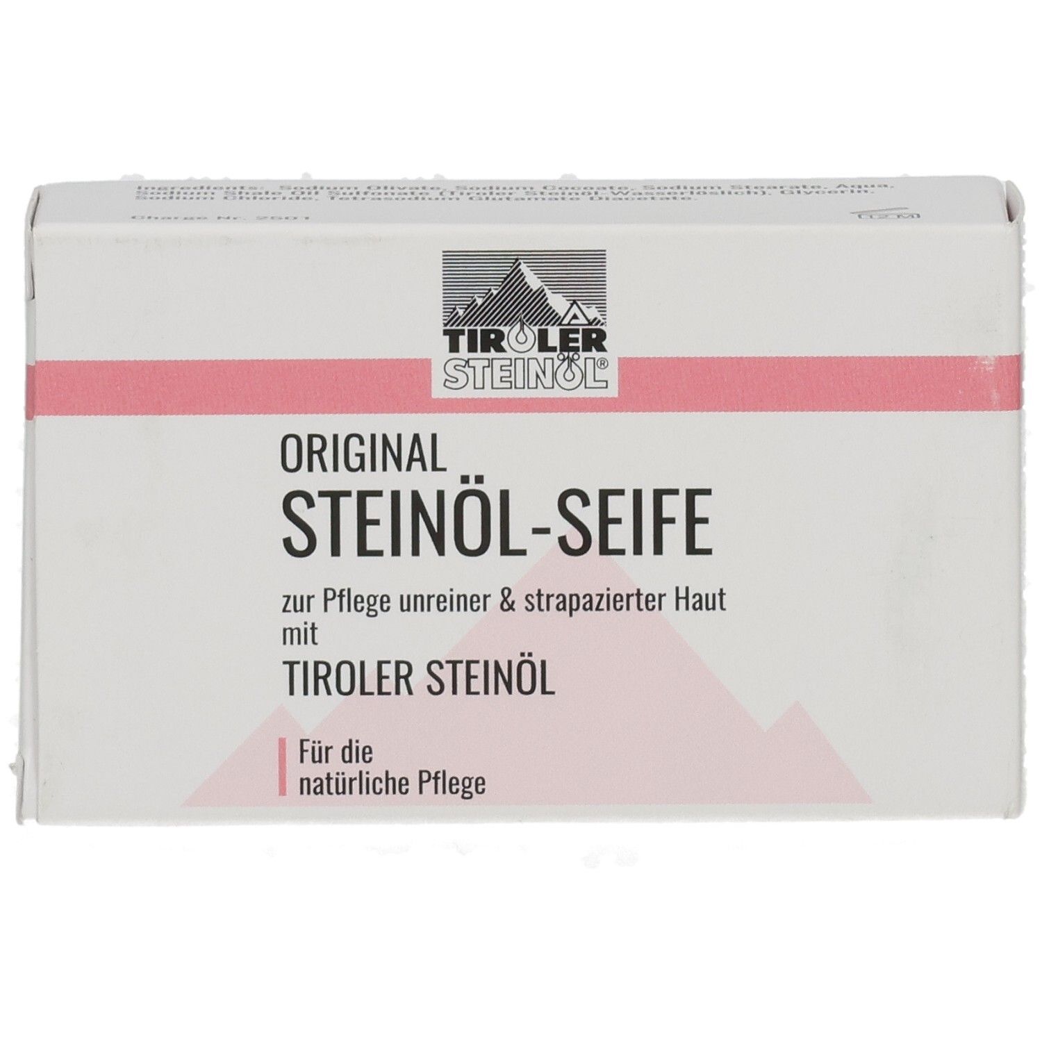 Weiße Kartonverpackung mit rosa Streifen. Aufschrift: ORIGINAL STEINÖL-SEIFE, TIROLER STEINÖL.