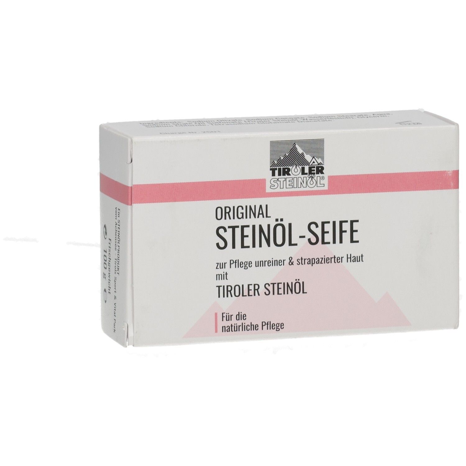 Weiße Kartonverpackung mit rosa Streifen. Aufschrift: ORIGINAL STEINÖL-SEIFE, TIROLER STEINÖL. 100 g.