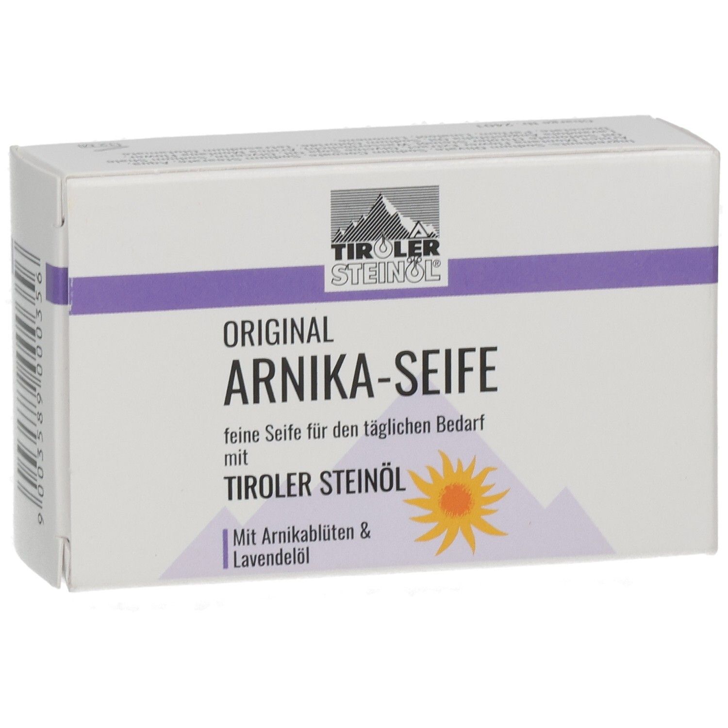 Weißer Karton mit lila Streifen. Aufschrift: ORIGINAL ARNIKA-SEIFE, TIROLER STEINOEL. Mit Arnikablüten & Lavendelöl.