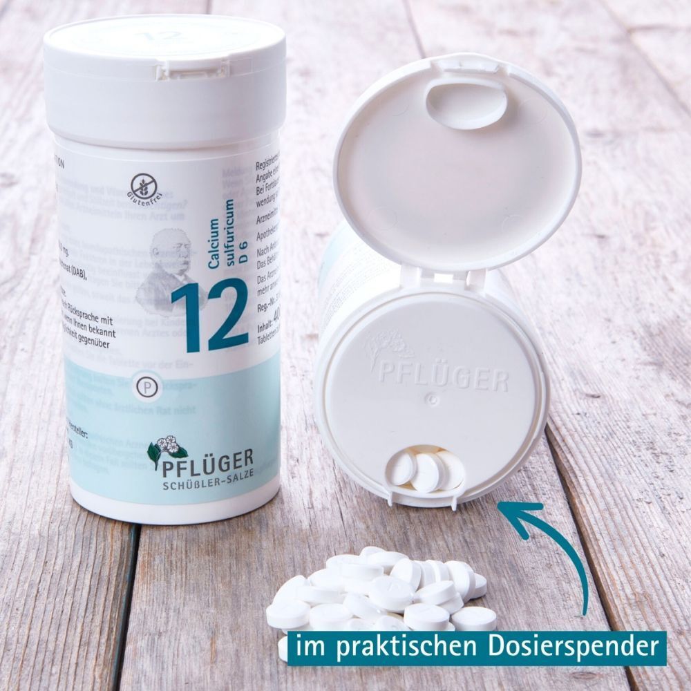 Tabletten-Dose geöffnet, Tabletten daneben. Text: im praktischen Dosierspender.