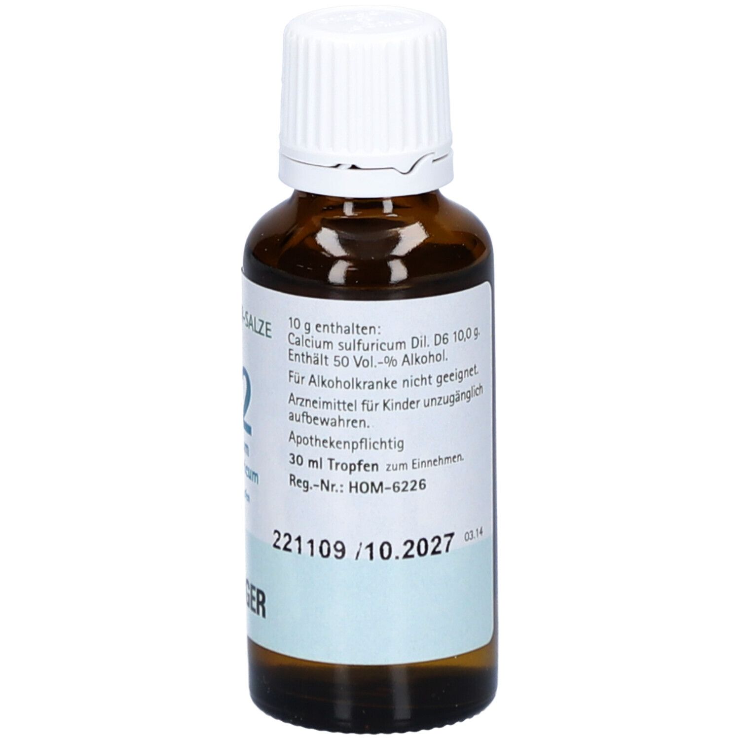 Braune Glasflasche mit weißem Deckel. Beschriftung: Schüßler-Salze 12 Calcium sulfuricum D6 Tropfen. Apothekenpflichtig. Verfallsdatum.