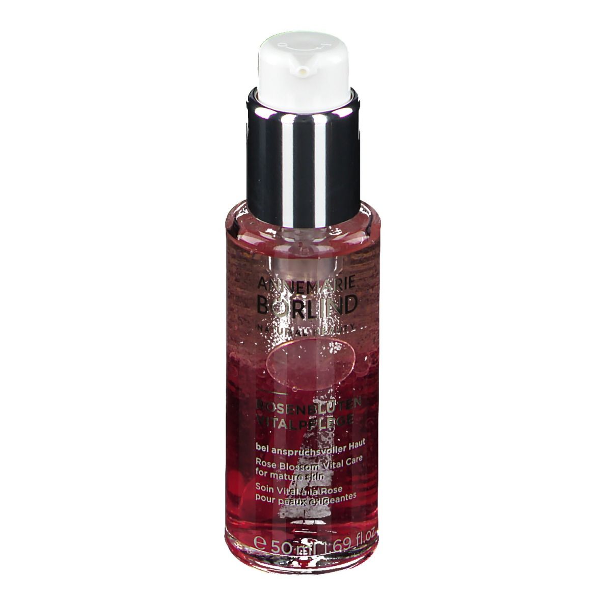 Flakon mit Flüssigkeit. Aufschrift: ANNEMARIE BÖRLIND. Rosenblüten Vitalpflege. Für anspruchsvolle Haut. Mit Spender.