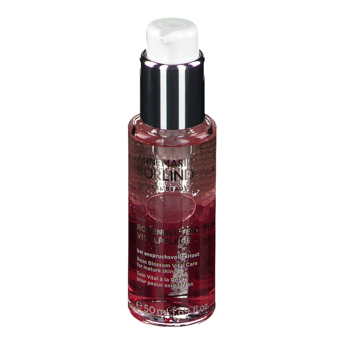 Flakon mit Flüssigkeit. Aufschrift: ANNEMARIE BÖRLIND. Rosenblüten Vitalpflege. Für anspruchsvolle Haut. Mit Spender.