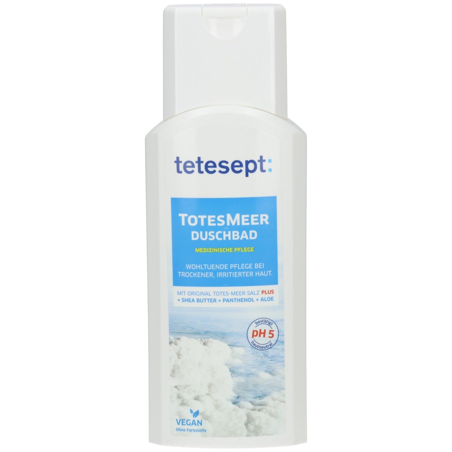Weiße Flasche tetesept Totes Meer Duschbad. Blaues Etikett mit Produktinformationen. pH 5-Zeichen. Vegan-Siegel.