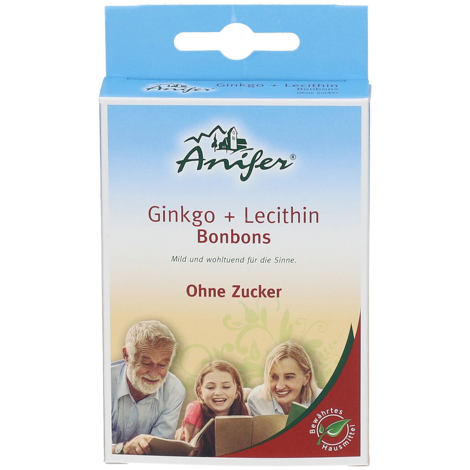 Kartonverpackung mit Produktnamen und Logo. Abgebildet sind eine ältere Person, ein Kind und eine Frau, die ein Buch betrachten.