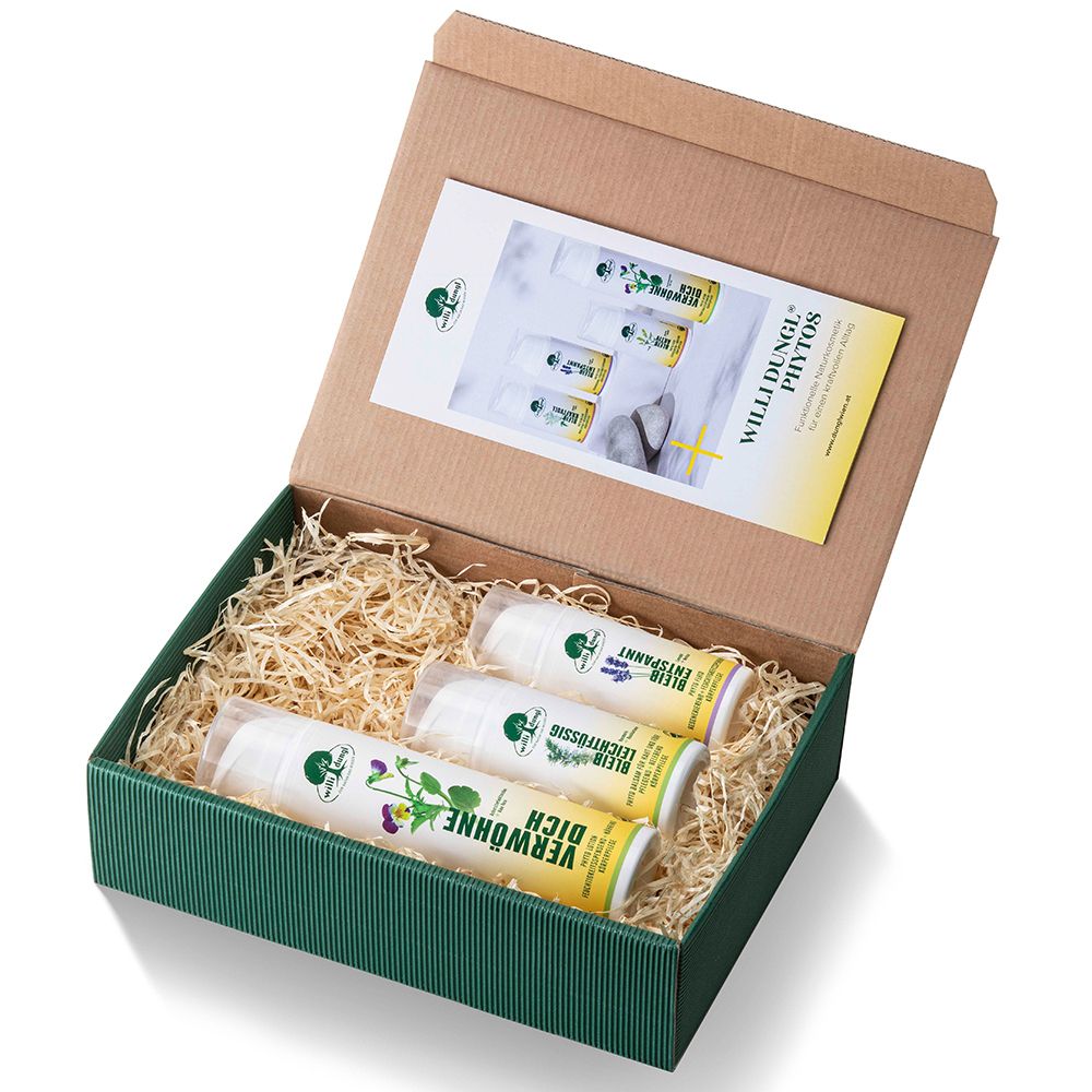 Geöffnete grüne Geschenkbox mit drei Cremes in zylindrischen Behältern. Aufschrift: Willi Dungl, Phytos. Innen: Broschüre.