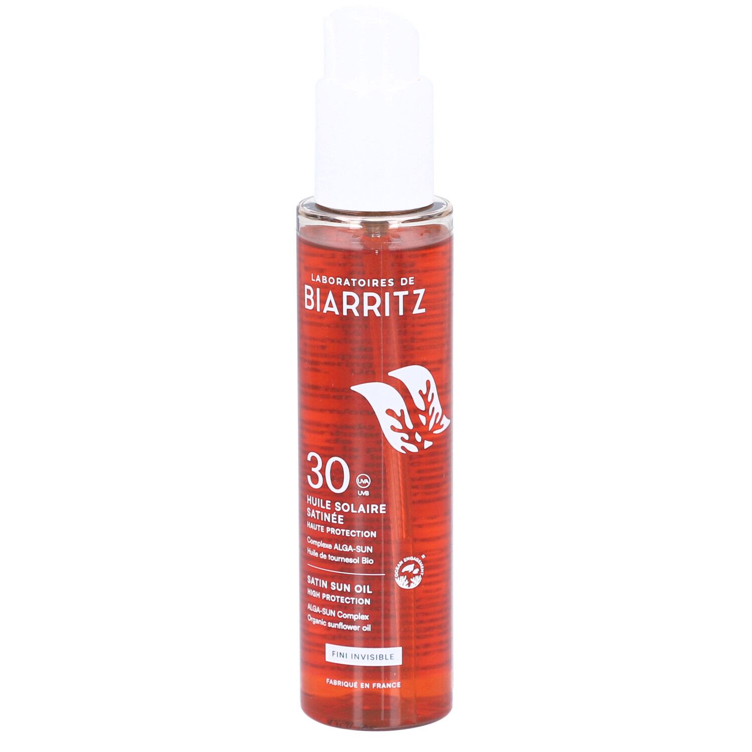 Sonnenschutzöl von Laboratoires de Biarritz. Transparente Flasche mit weißem Pumpkopf. Rote Flüssigkeit sichtbar. Text und Logo.