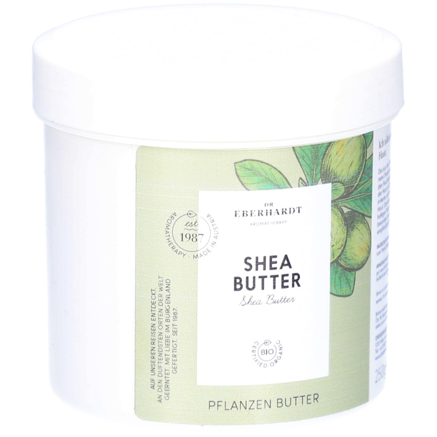 Weißer Tiegel mit Deckel. Aufkleber mit Produktnamen und Logo. Aufschrift: Shea Butter, Pflanzenbutter. Bio-Zertifizierung.