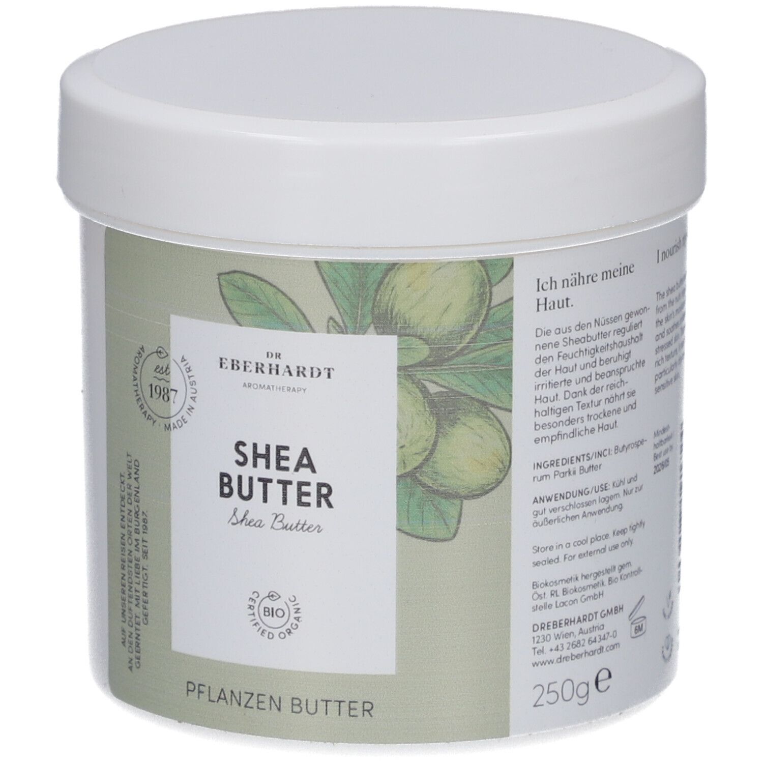 Weißer Tiegel mit Deckel. Aufkleber mit Produktnamen, Logo und Text. Aufschrift: Shea Butter, Pflanzenbutter. Bio-Zertifizierung. 250g.