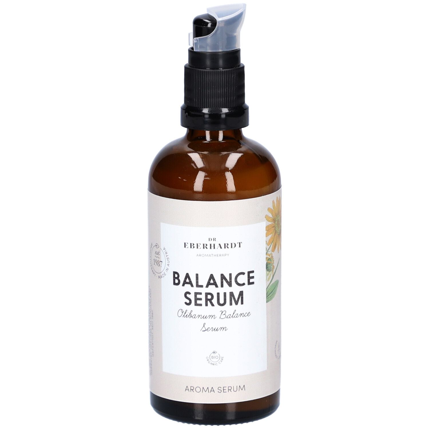 Braune Glasflasche mit schwarzem Pumpkopf. Aufschrift: Balance Serum. Mit floraler Illustration.
