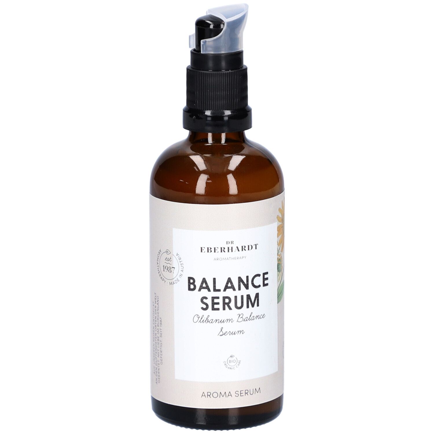 Braune Glasflasche mit schwarzem Pumpkopf. Aufschrift: Balance Serum. Mit floraler Illustration.
