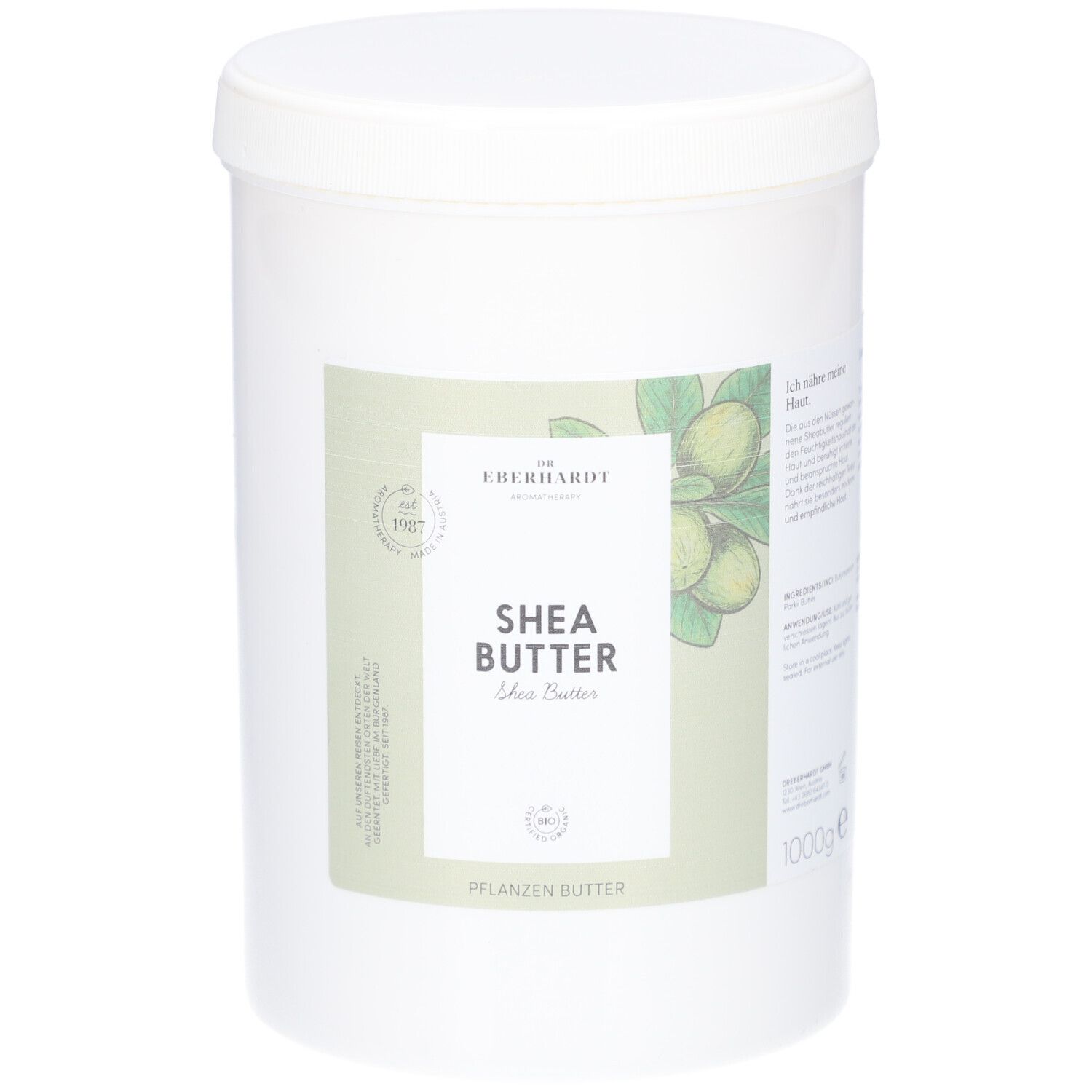 Weißer Eimer mit Deckel. Aufkleber mit Produktname, Shea Butter, und Logo. Abbildung von Sheanüssen.