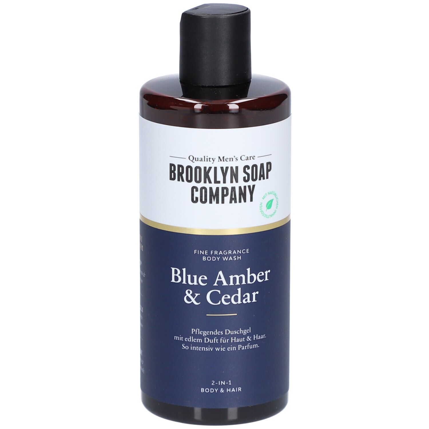 Duschgel-Flasche mit schwarzem Deckel. Aufschrift: Brooklyn Soap Company, Blue Amber & Cedar. 2-in-1 für Körper & Haar.