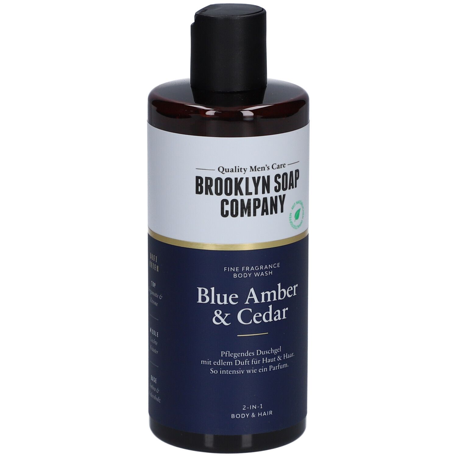 Duschgel-Flasche mit schwarzem Deckel. Aufschrift: Brooklyn Soap Company, Blue Amber & Cedar. 2-in-1 für Körper & Haar.