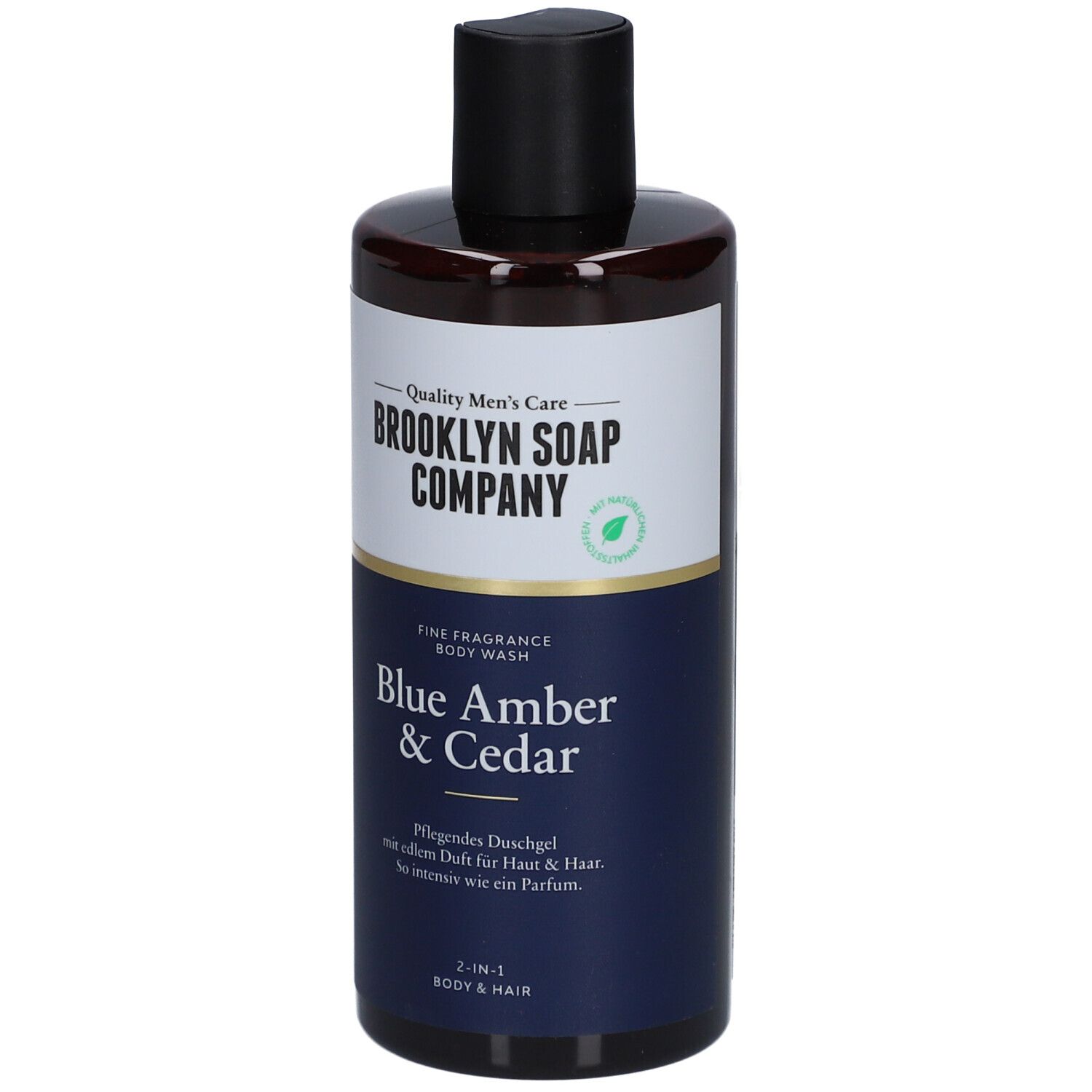 Duschgel-Flasche mit schwarzem Deckel. Aufschrift: Brooklyn Soap Company, Blue Amber & Cedar. 2-in-1 für Körper & Haar.