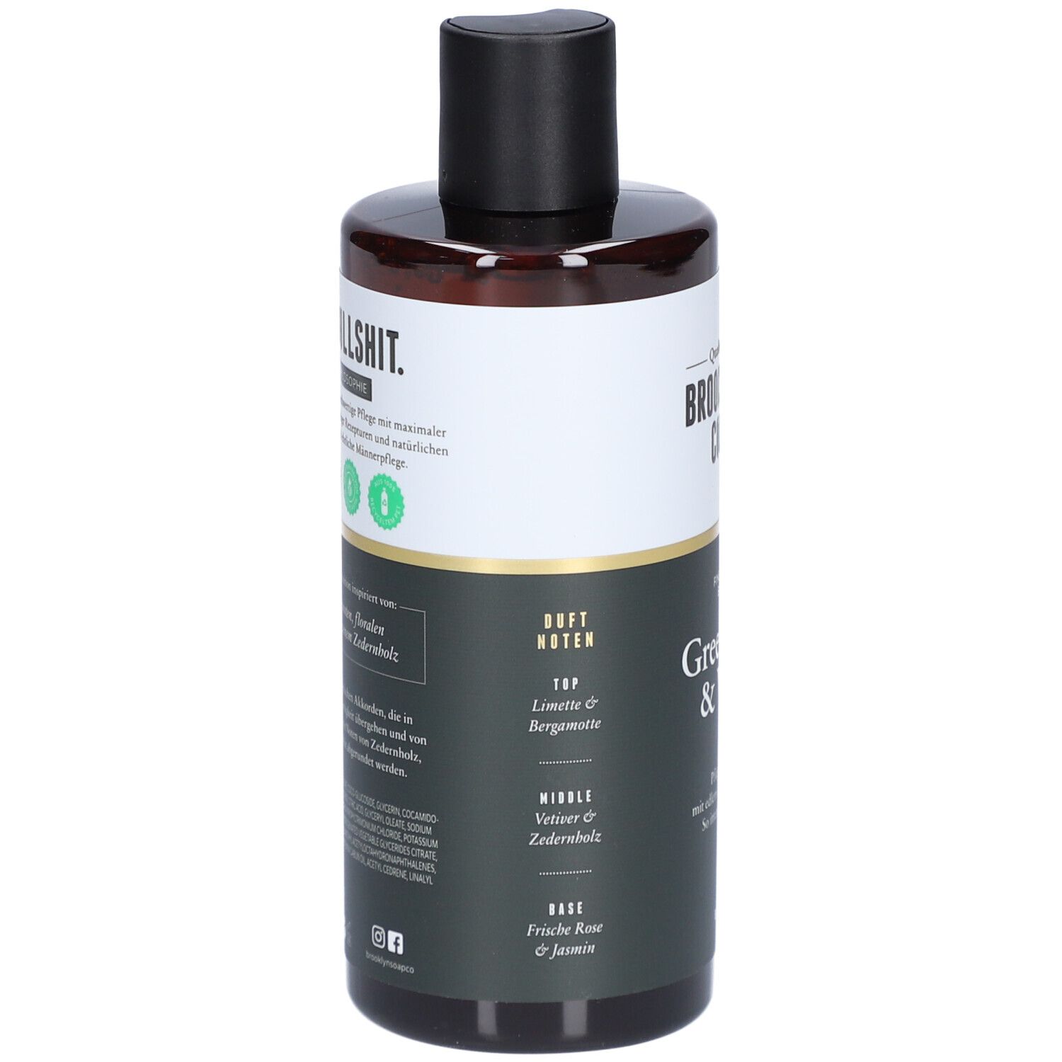 Duschgel-Flasche mit schwarzem Deckel. Aufschrift: Brooklyn Soap Company, Green Wood & Vetiver. Duftnoten.