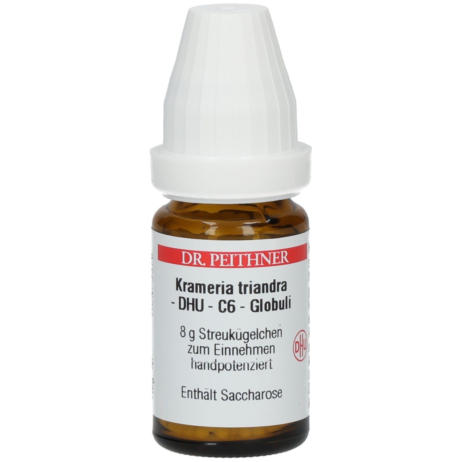 Braune Glasflasche mit weißem Deckel. Etikett mit Produktnamen: Kramerie triandra - DHU - C6 - Globuli. Enthält Saccharose.