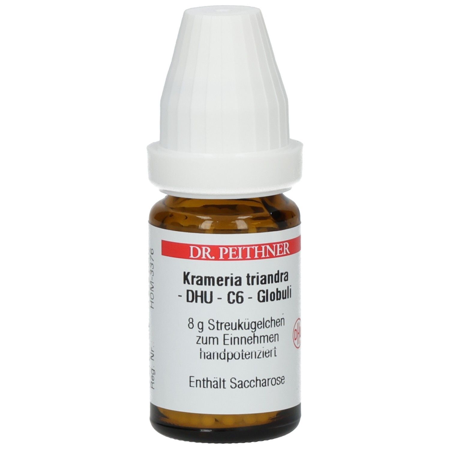 Braune Glasflasche mit weißem Deckel. Etikett mit Produktnamen: Kramerie triandra - DHU - C6 - Globuli. Enthält Saccharose.