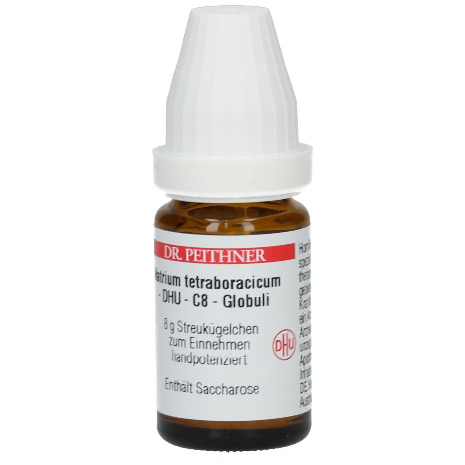 Braune Glasflasche mit weißem Deckel. Etikett mit Produktnamen, Hersteller und Inhaltsangabe. Enthält Globuli.