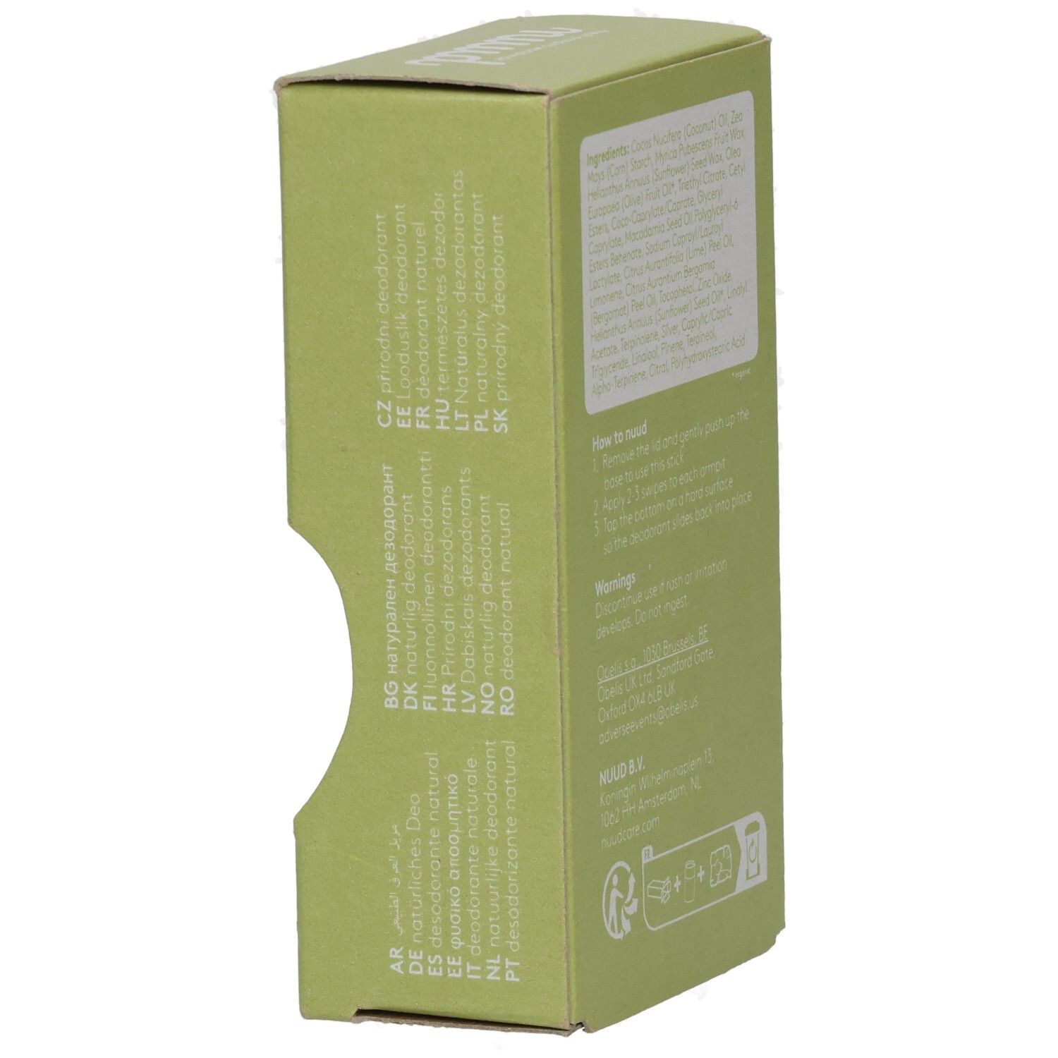 Seitenansicht des grünen Kartons. Text in verschiedenen Sprachen. Recycling-Symbol.