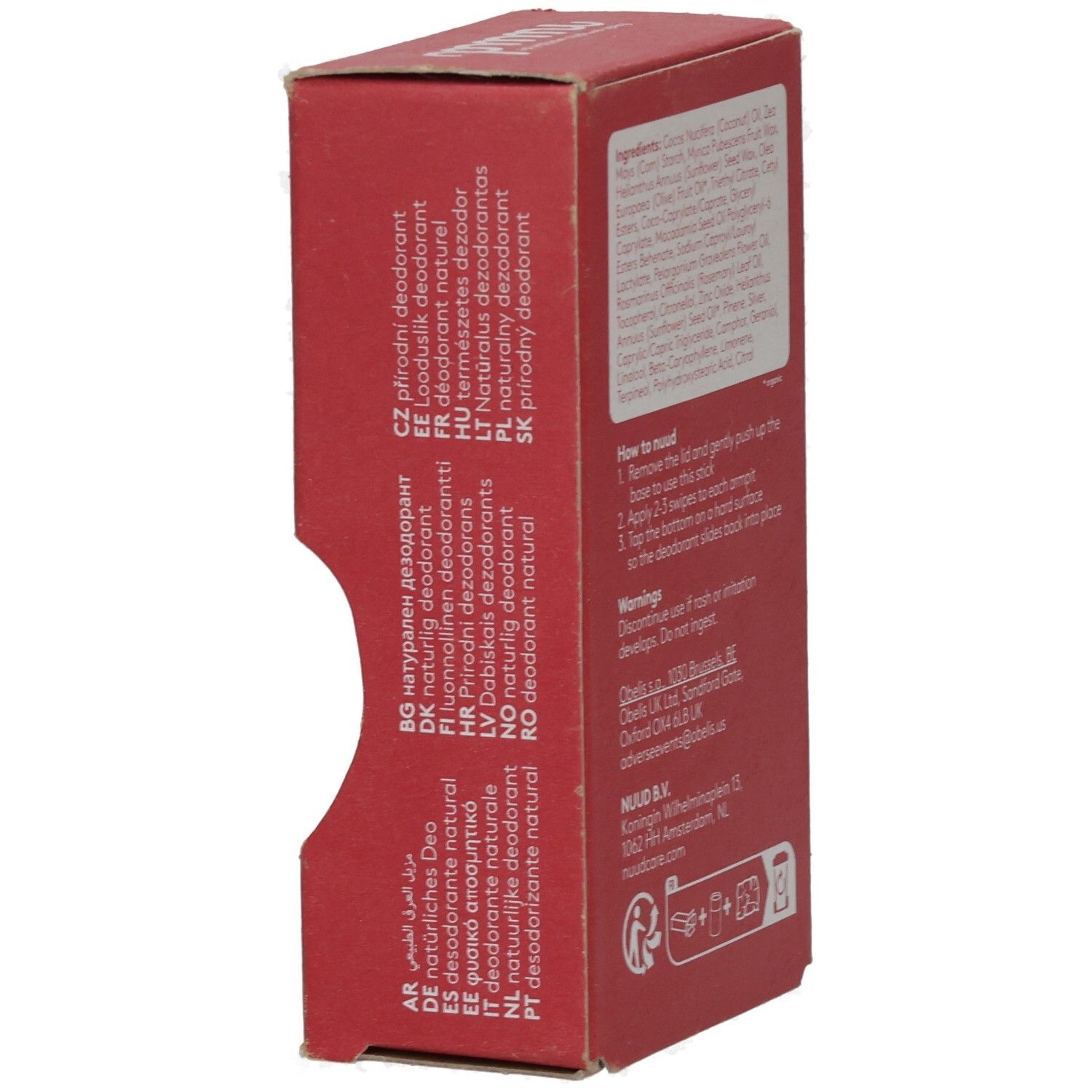 Rote Kartonseite mit Text in verschiedenen Sprachen. Enthält Informationen über das Produkt.