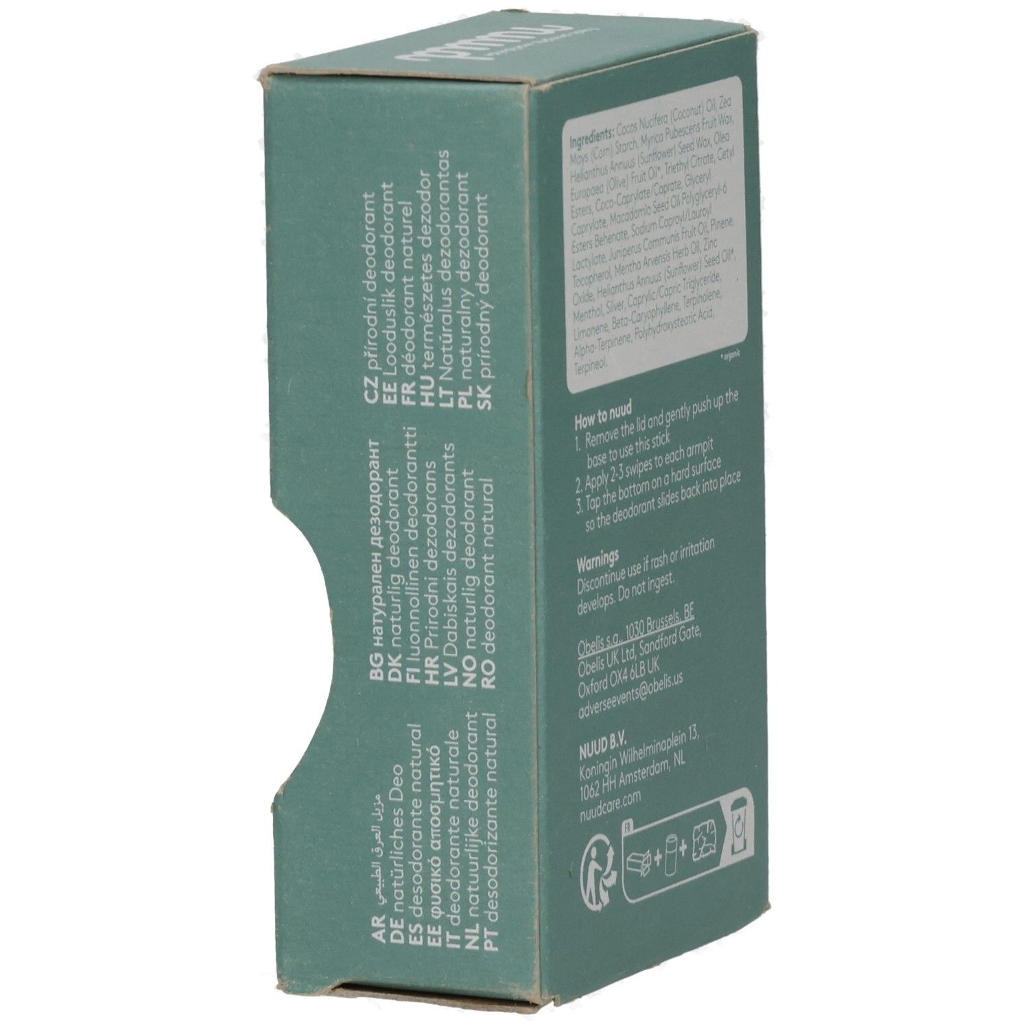 Grüne Verpackung mit Text in verschiedenen Sprachen. Enthält Informationen über das Produkt in mehreren Sprachen.