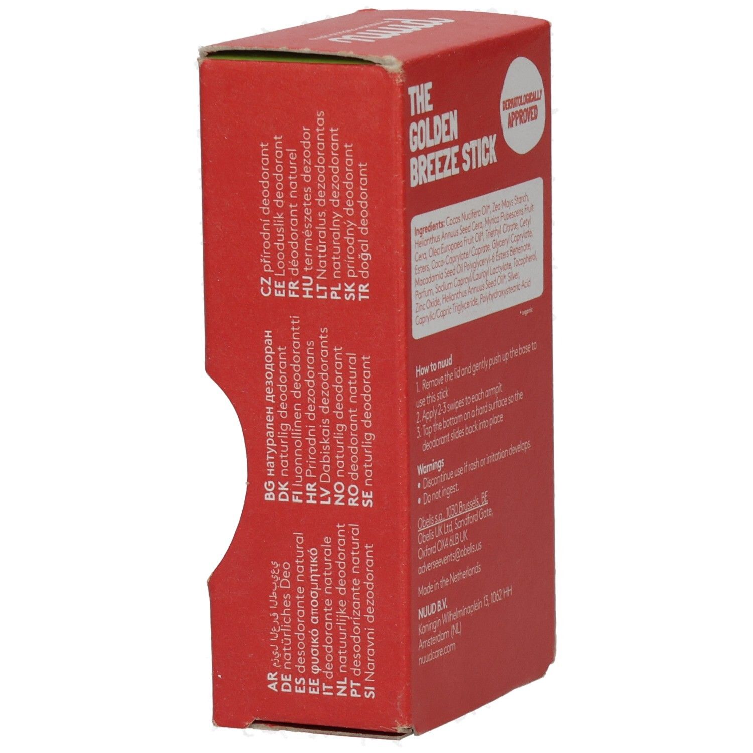Rote Verpackung mit Text in verschiedenen Sprachen. Aufschrift: The Golden Breeze Stick. Dermatologisch geprüft. Hergestellt in den Niederlanden.