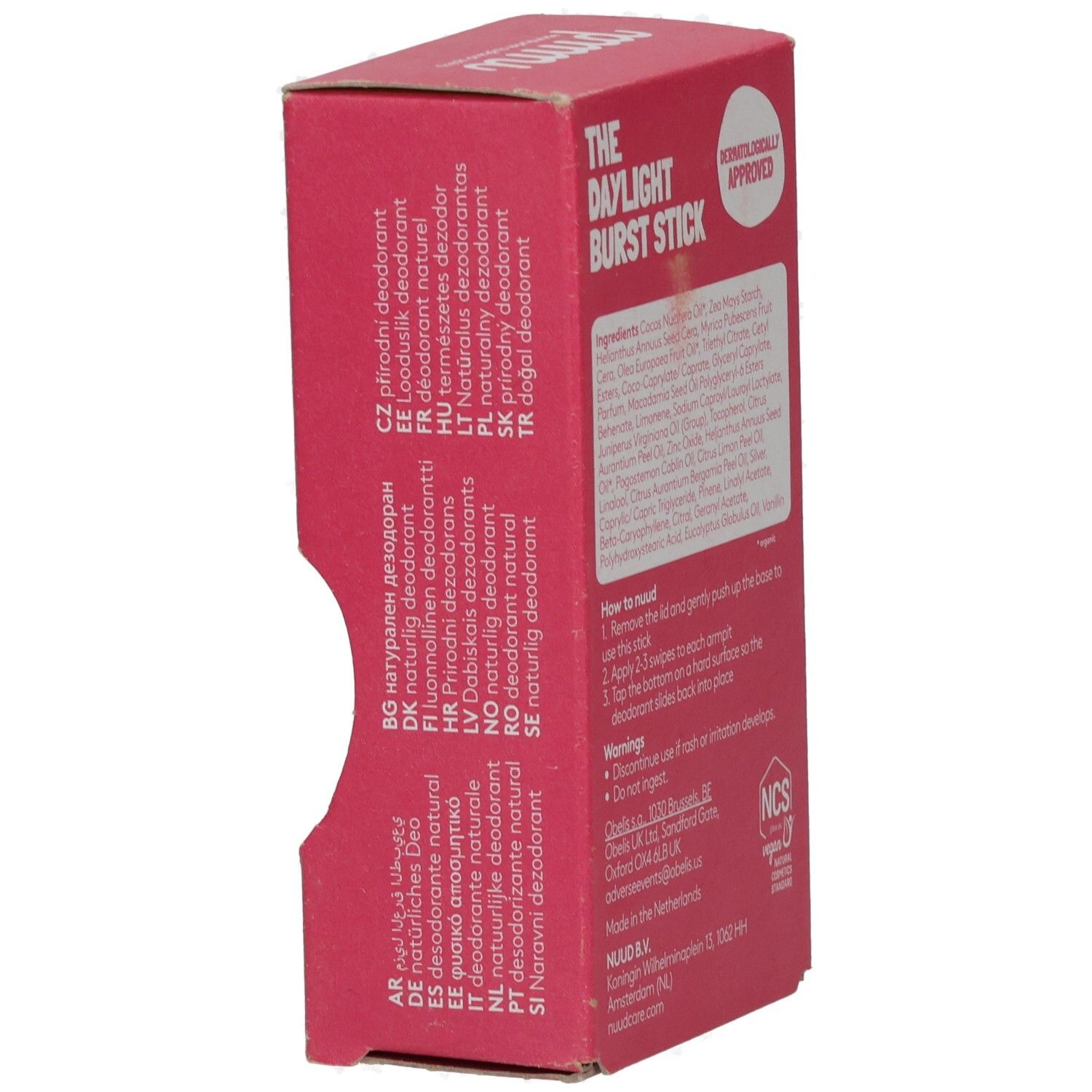 Rosa Verpackung mit Produktinformationen in verschiedenen Sprachen. Aufschrift: The Daylight Burst Stick, Dermatologically Approved.