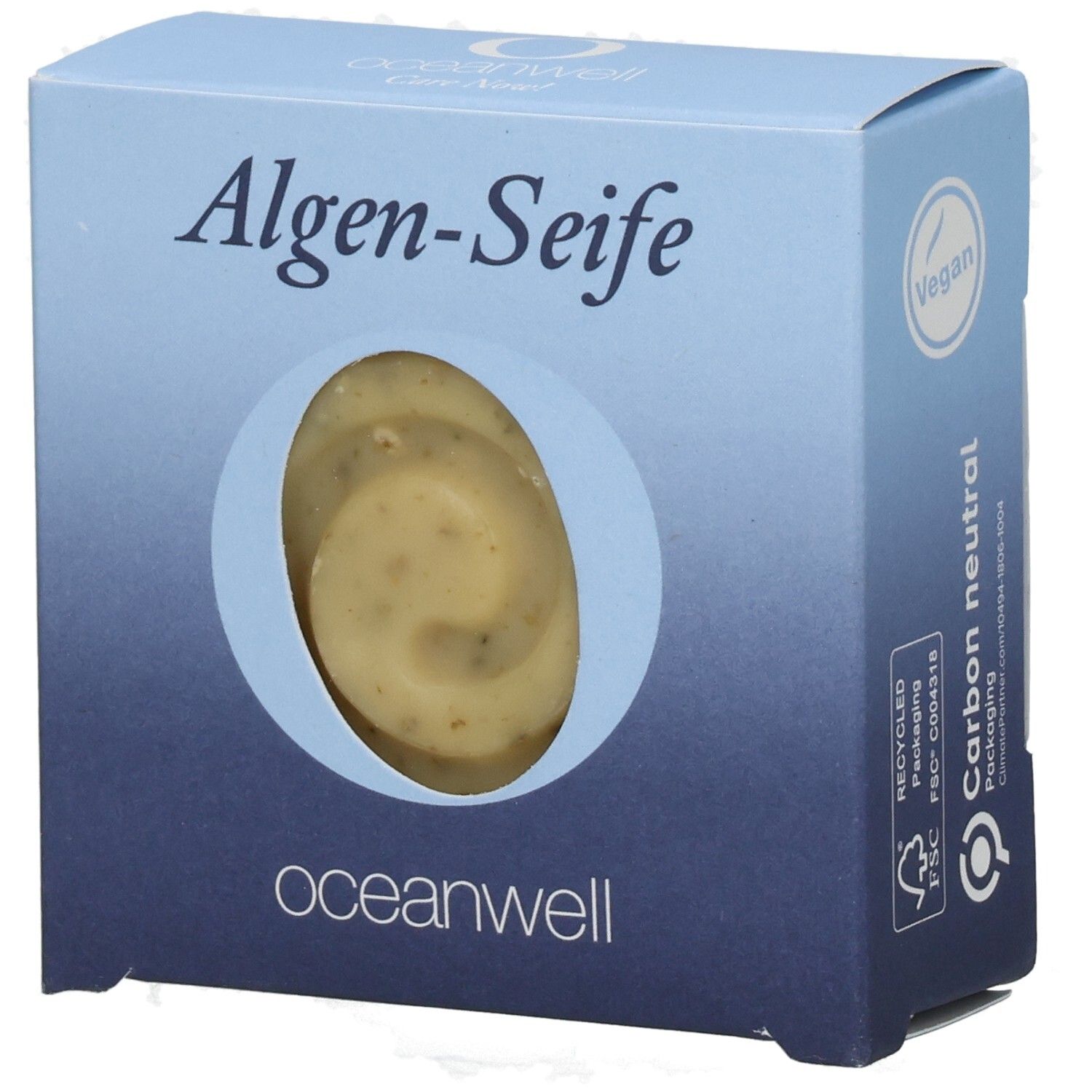 Hellblaue Schachtel mit Algen-Seife. Sichtfenster zeigt Seife. Vegan-Siegel. oceanwell-Logo.