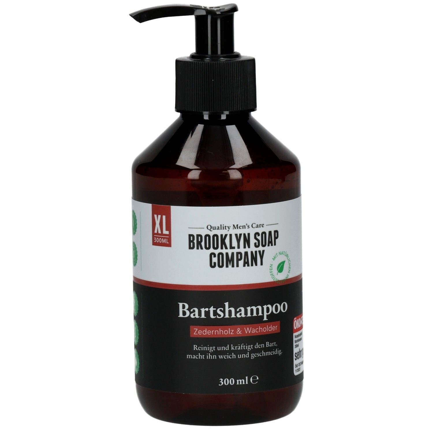 Braune Flasche mit schwarzem Pumpkopf. Aufschrift: Brooklyn Soap Company Bartshampoo Zedernholz & Wacholder XL. 300 ml.