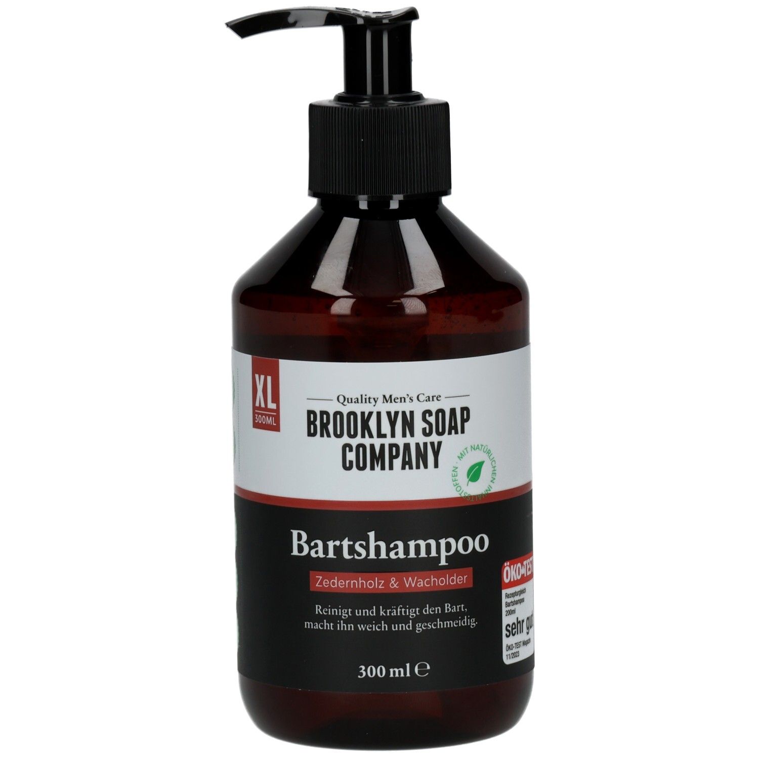 Braune Flasche mit schwarzem Pumpkopf. Aufschrift: Brooklyn Soap Company Bartshampoo Zedernholz & Wacholder XL. 300 ml.