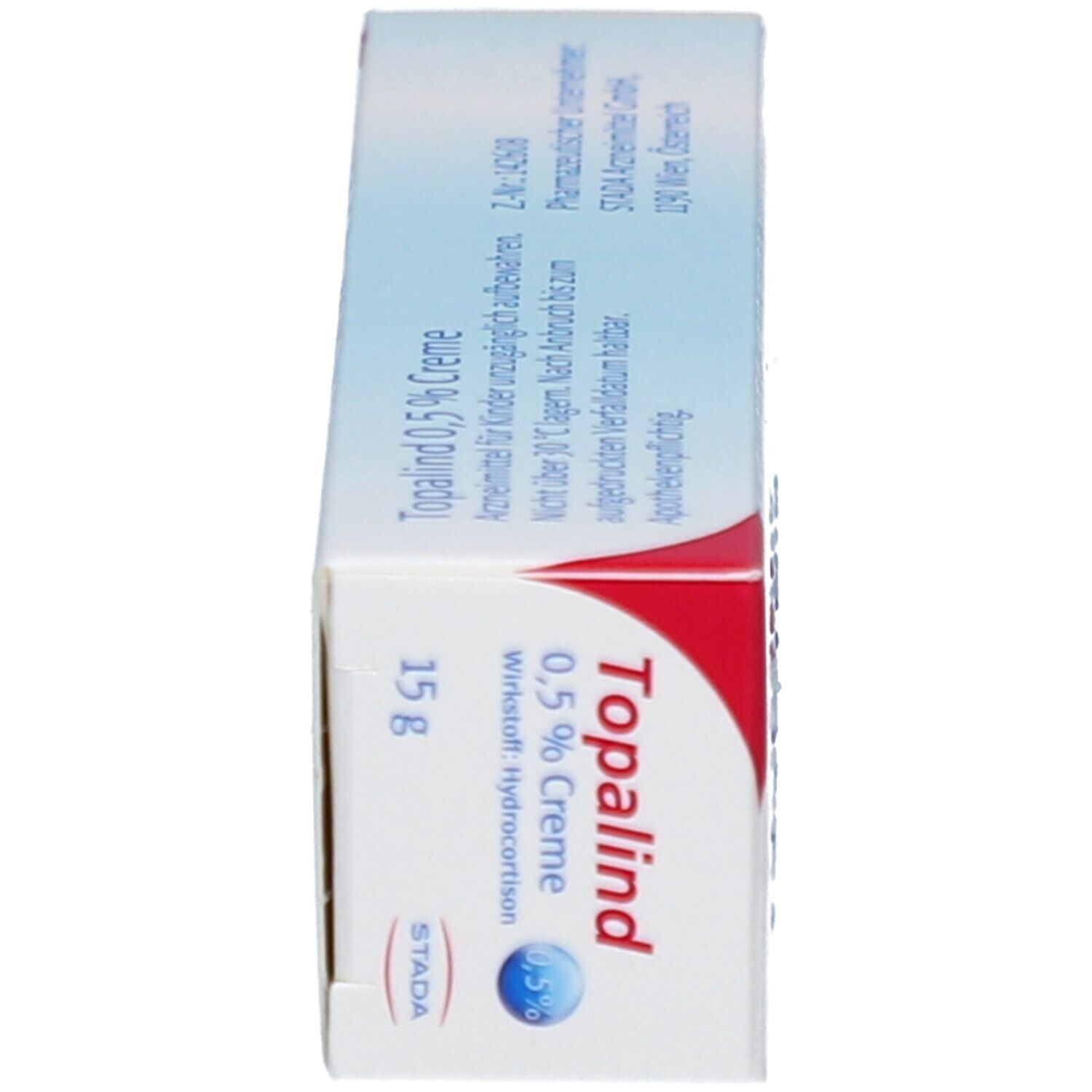 Seitenansicht der Topalind 0,5% Creme-Verpackung. Enthält Produktnamen, Logo und 15g Creme-Angabe. Rote und weiße Akzente.