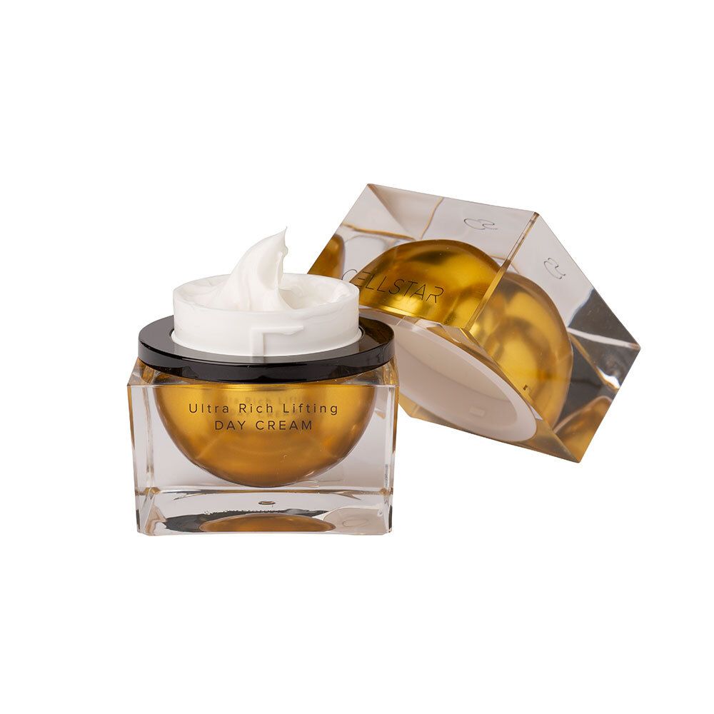 Creme in quadratischem Glasbehälter mit goldener Basis und schwarzem Deckel. Geöffnete Verpackung.