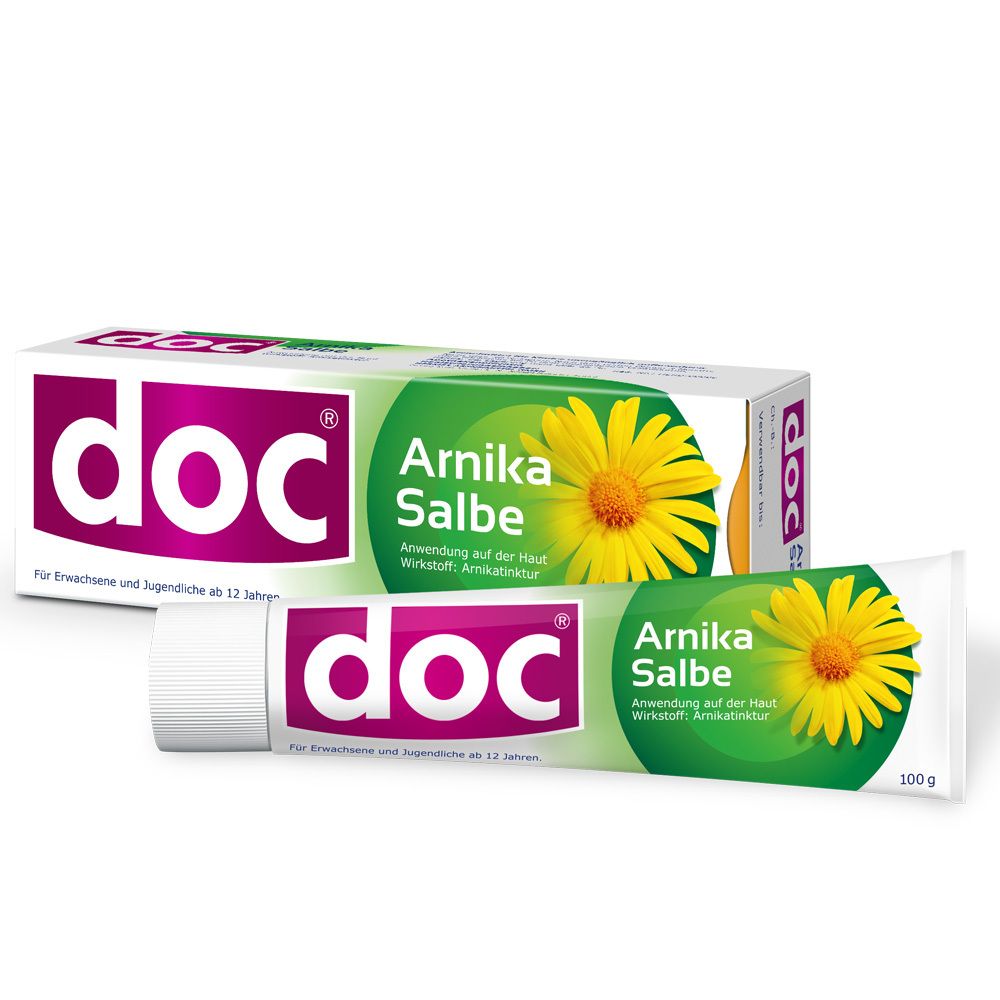 Packung und Tube doc® Arnika Salbe. Weiße Tube und Schachtel mit pinkfarbenem doc® Logo und grüner Banderole mit gelber Blüte. 100g.