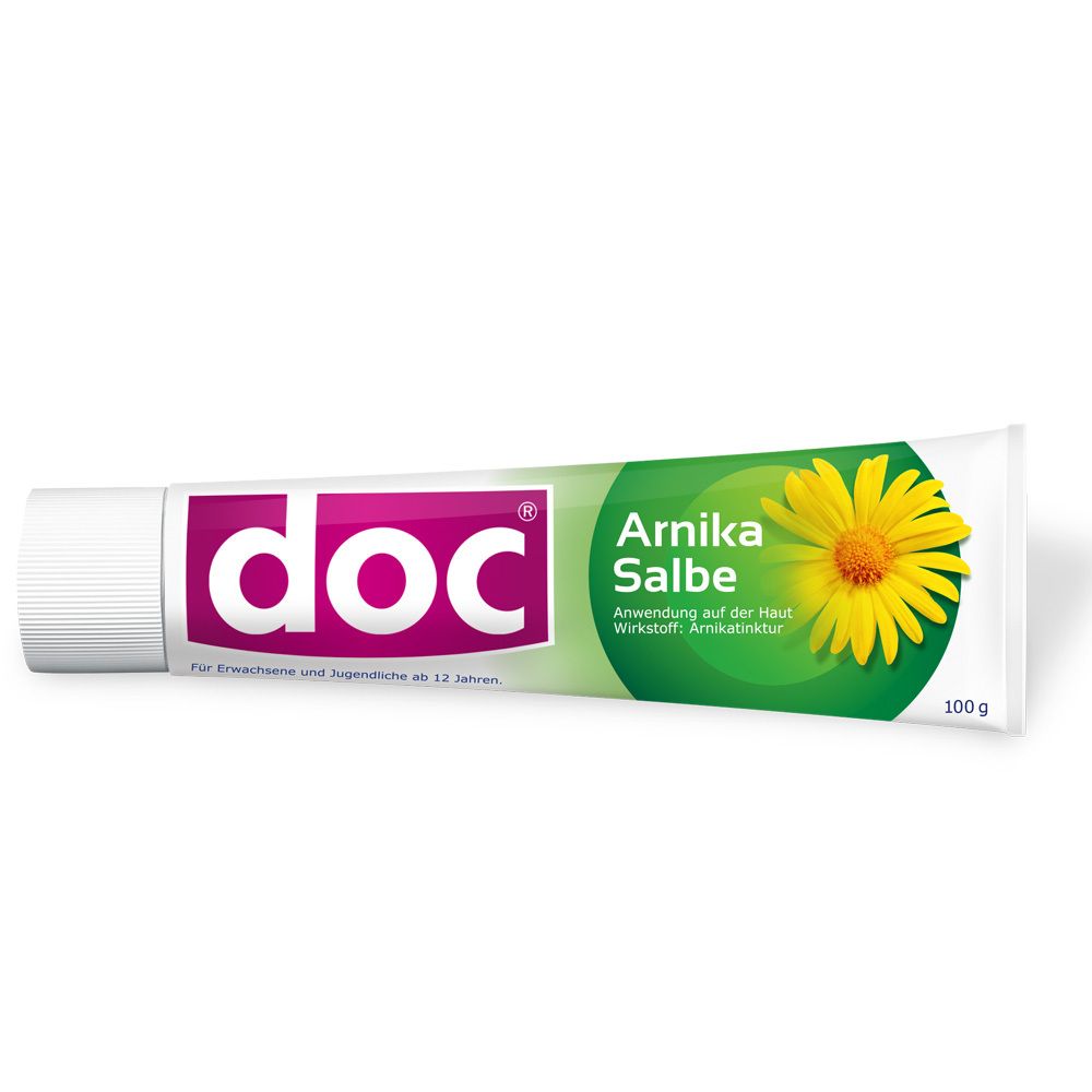 Tube doc® Arnika Salbe. Weiße Tube mit pinkfarbenem doc® Logo und grüner Banderole mit gelber Blüte. 100g.