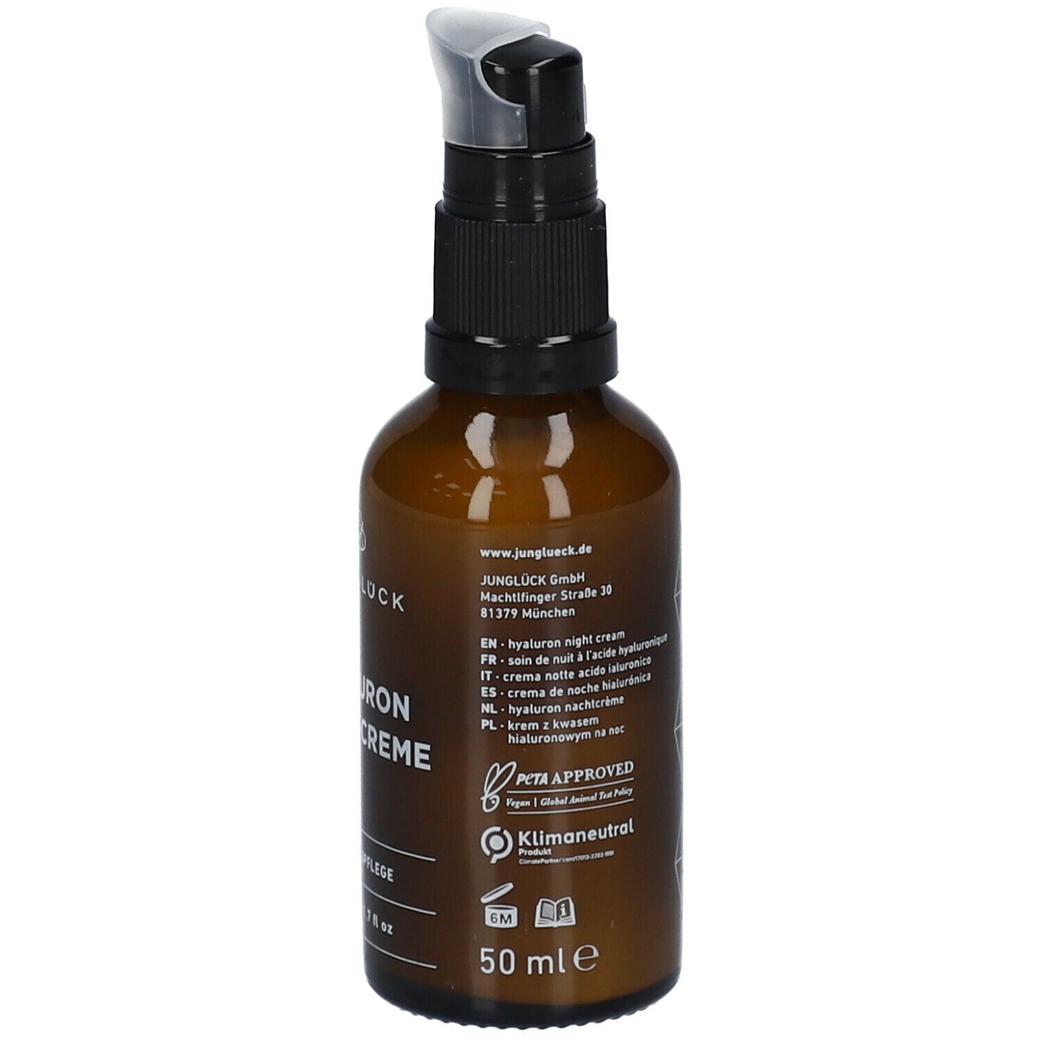 Braune Glasflasche mit schwarzem Pumpkopf. Aufschrift: JUNGLÜCK, Hyaluron Nachtcreme. Text in mehreren Sprachen. PETA-Siegel, Klimaneutral.