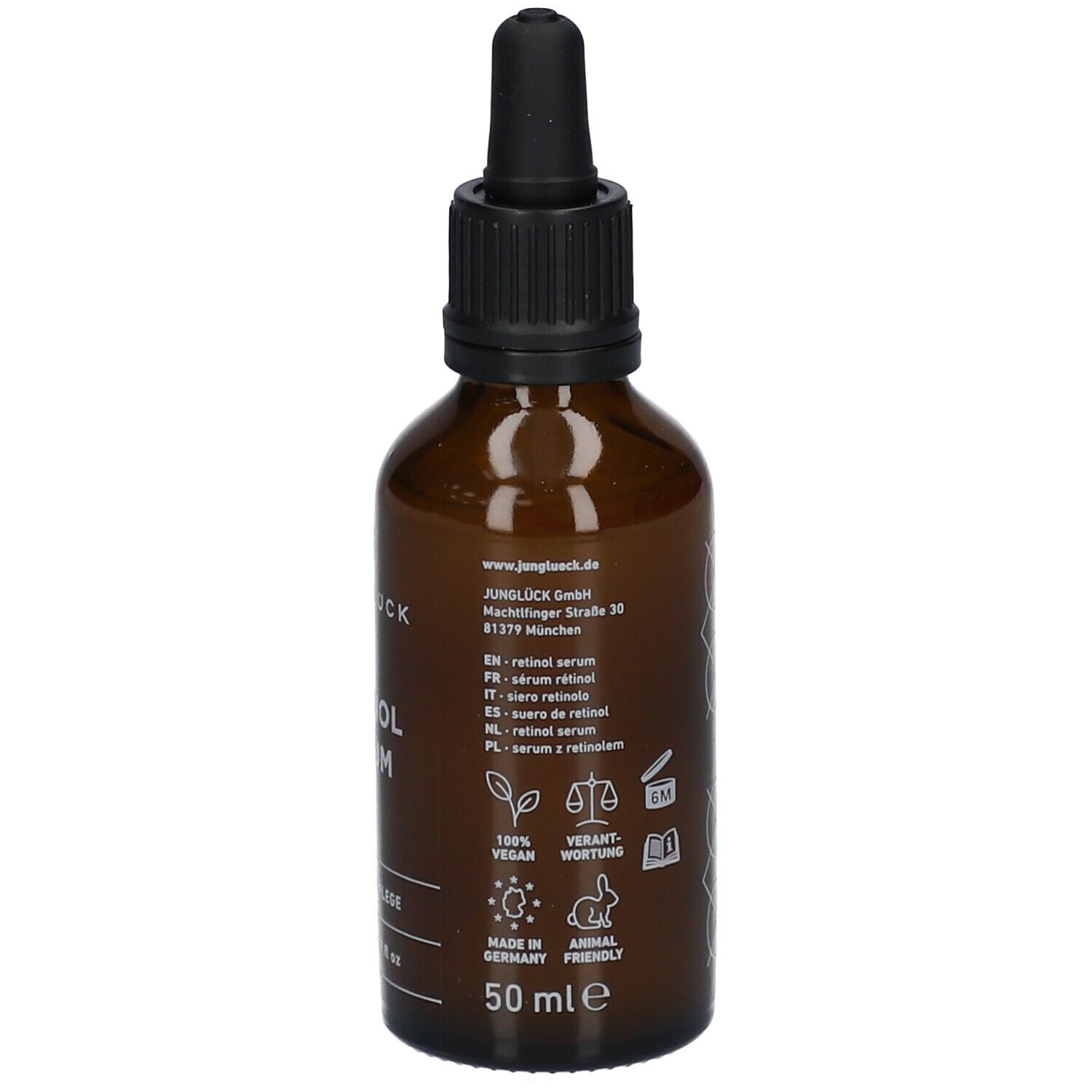 Braune Glasflasche mit schwarzem Tropfer. Aufschrift: JUNGLÜCK, Retinol Serum. Text in mehreren Sprachen. 50 ml, Vegan.
