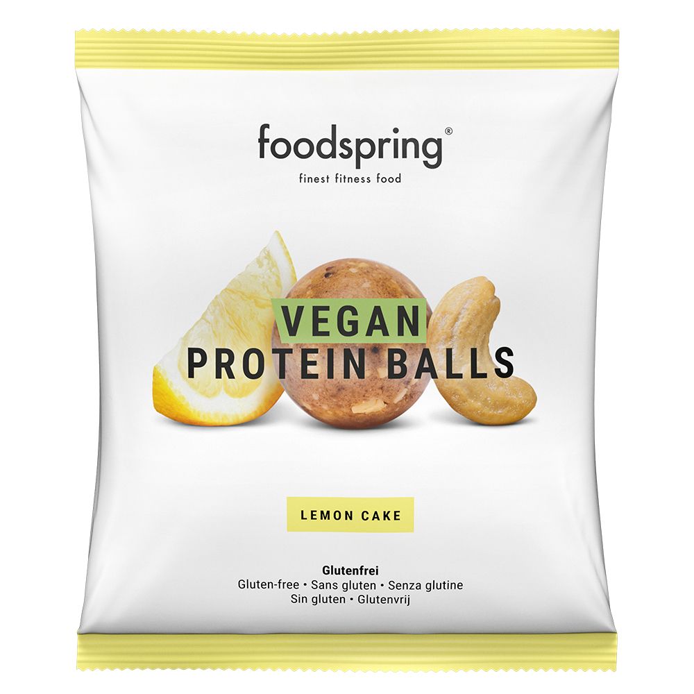 Verpackung mit Vegan Proteinballs Lemon Cake. Logo und Produktbezeichnung. Zitrone und Cashew-Nuss abgebildet. Glutenfrei.