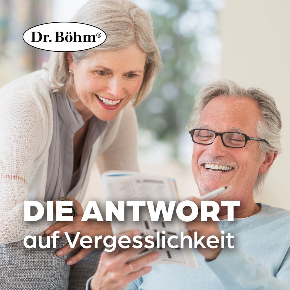 Älteres Paar beim Kreuzworträtsel. Text: DIE ANTWORT auf Vergesslichkeit. Logo Dr. Böhm®.