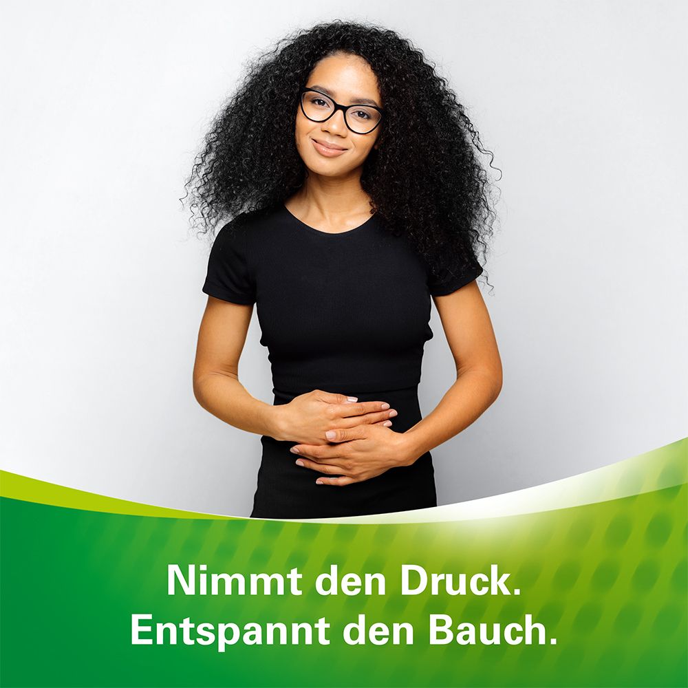 Frau mit Händen auf dem Bauch. Text: Nimmt den Druck. Entspannt den Bauch.