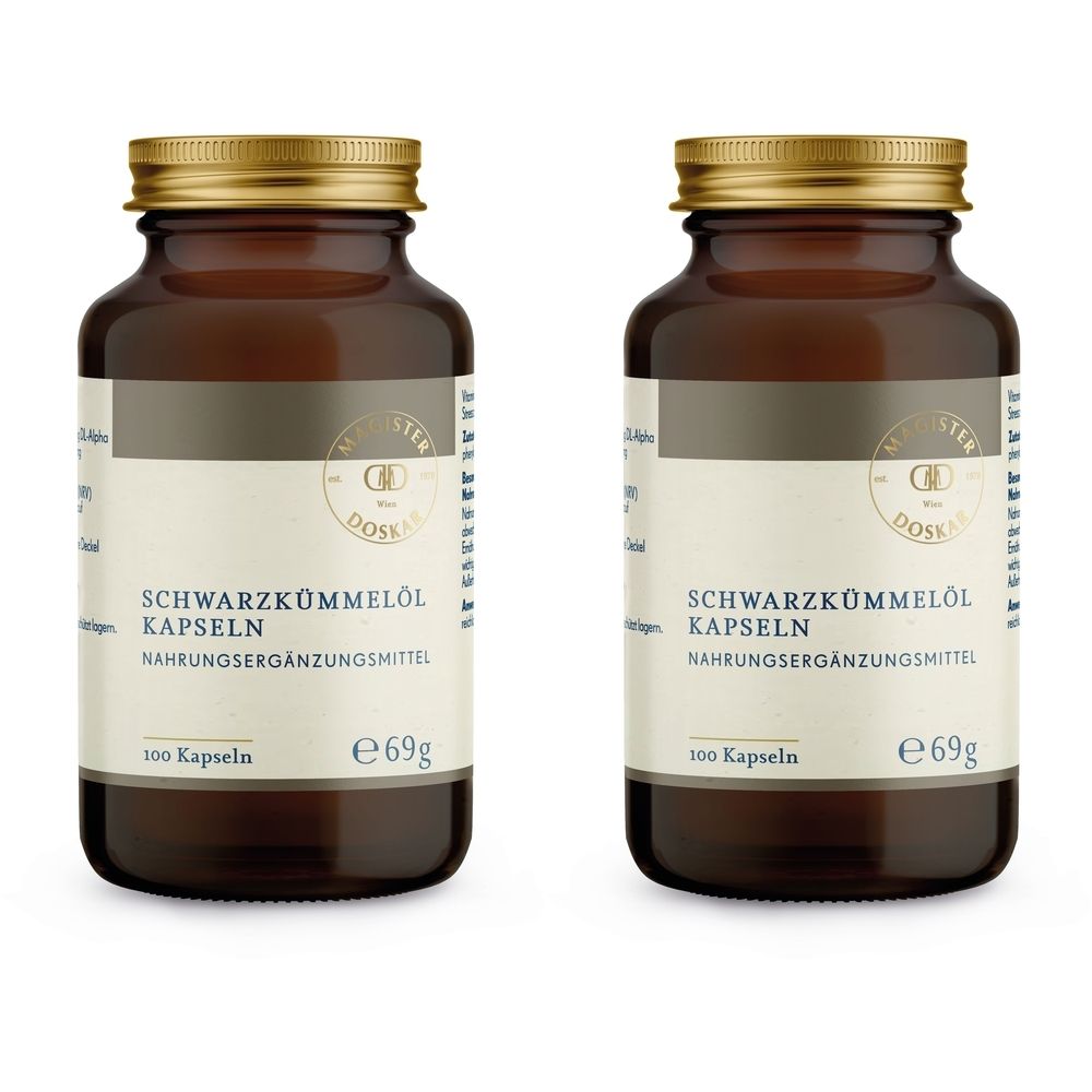 Zwei braune Glasflaschen mit goldenen Deckeln. Auf den Etiketten steht "SCHWARZKÜMMELÖL KAPSELN".