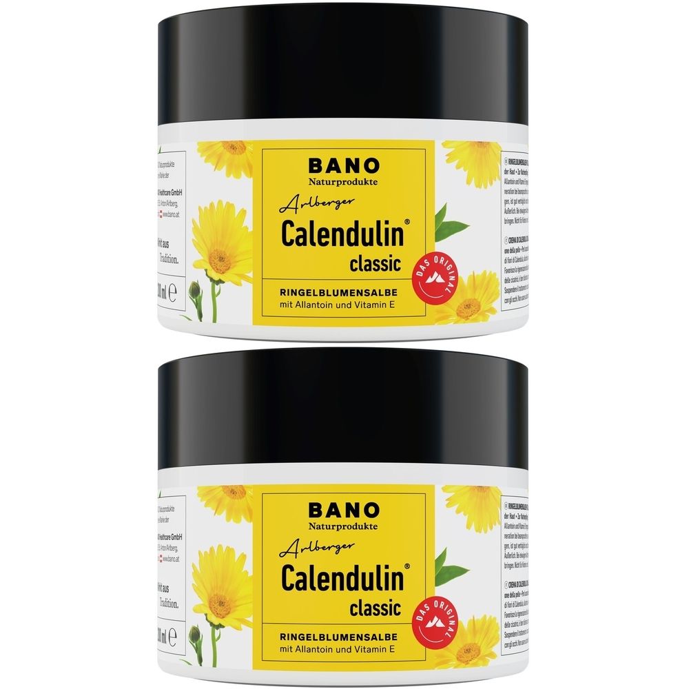 Zwei Tiegel Arlberger Calendulin classic Ringelblumensalbe. Schwarzer Deckel, gelbes Etikett mit Produktnamen und Logo.