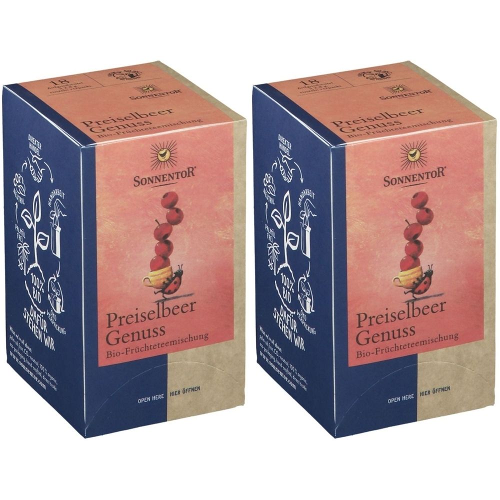 Zwei rechteckige Kartons mit dem Aufdruck "Preiselbeer Genuss". Aufschrift "Sonnentor". Abbildung von Preiselbeeren.