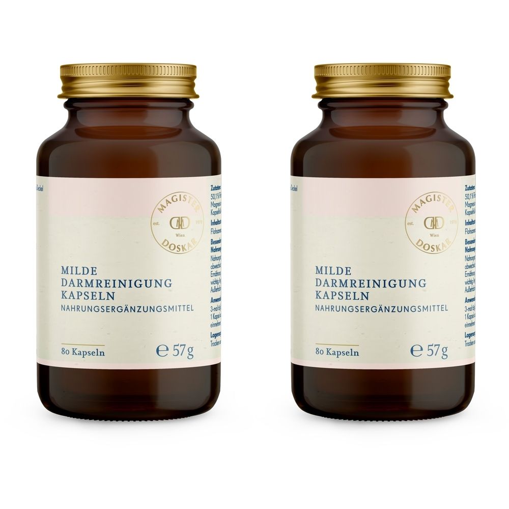 Zwei braune Glasflaschen mit goldenen Deckeln. Auf den Etiketten steht: Milde Darmreinigung Kapseln. Nahrungsergänzungsmittel.