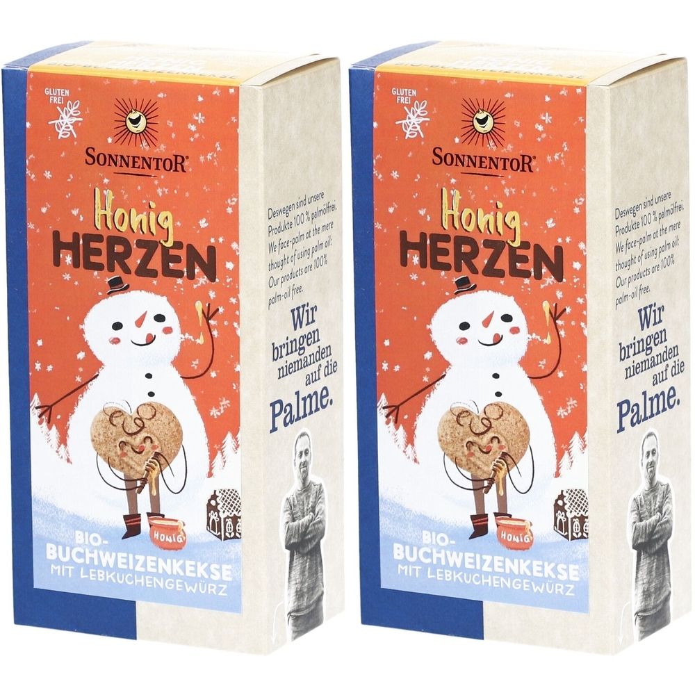 Zwei Kartons mit Honigherzen-Keksen. Aufdruck: SonnentoR, Honig Herzen, Schneemann mit Keks, glutenfrei, Bio-Buchweizenkekse.