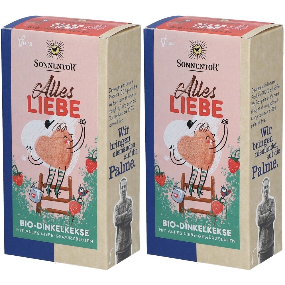 Zwei Kartons mit Aufschrift "SONNENTOR Alles LIEBE". Aufdruck: Herz-Figur, Erdbeeren, Text. Vegan-Siegel.